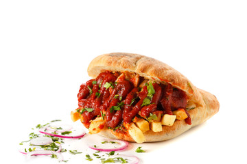 fast food French fries with meat filled with ketchup in a bun with onions. gyros isolated