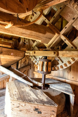 Fototapeta na wymiar The mechanism of windmill (onterior of old windmill in Estonia)