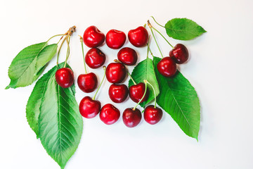 berries and leaves of cherry on a white background.