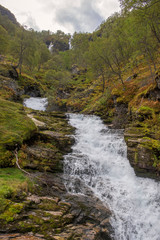 Creek with waterfalls in mountaiuns of Norway