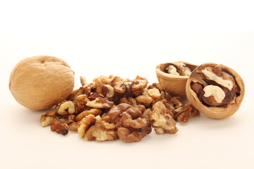 A pile of peeled walnuts at white background	