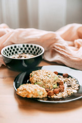 .Breakfast with granola and yogurt with nuts and seeds on wood with fabric