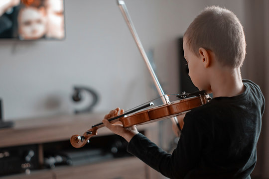 Handle Hold Violin Shot From Behind. Little Boy Carrying Violin. Young Boy Playing Violin, Talented Violin Player. Musical Instrument.