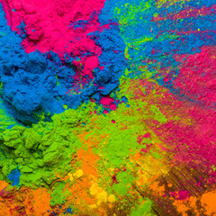 Holi Colorful festival of colored paints of powders and dust. colorful background. Holiday bright colors for the entertainment
