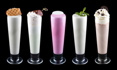 Set of milkshakes with different fillings. On dark background