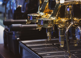 Fototapeta premium Barista working in a coffee shop, Close up of barista presses ground coffee using tamper, Barista Make Coffee Portafilter Concept