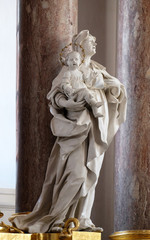 Obraz premium Saint Anne statue on the main altar in Amorbach Benedictine monastery church in Lower Franconia, Bavaria, Germany