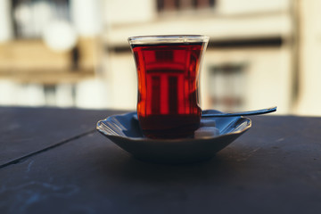 Reflection of a window in a glass of Turkish tea. Istanbul Turkey