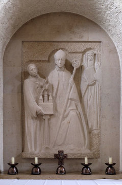 Wurzburg bishop Adalbero, the savior of the monastery Egbert and the holy Makarius of Wurzburg, altar in Munsterschwarzach Abbey, Benedictine monastery, Germany
