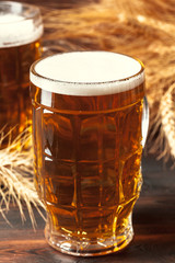 Glass beer on wood background