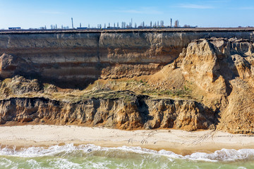 Mountain landslide in an environmentally hazardous area. Large crack in ground, descent of large...