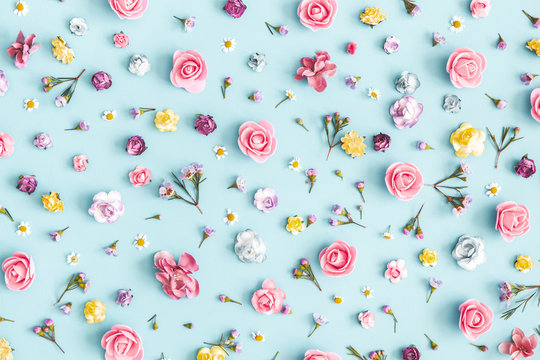 Flowers composition. Pattern made of colorful flowers on pastel blue background. Spring, easter, summer concept. Flat lay, top view