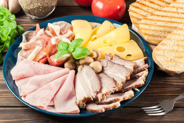 Cold meat platter with ham, prosciutto, bacon and cheese