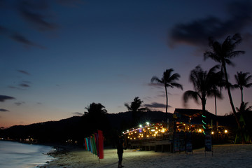A restaurant on a beach in twilight time