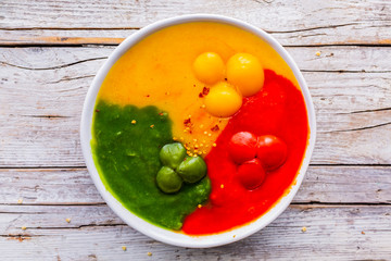 Colorful cream and spicy pepper soup.