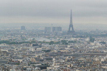 Naklejka premium Buildings and skyline of Paris, France with Eiffel Tower, viewed from top of the Sacre-coeur in Montmartre