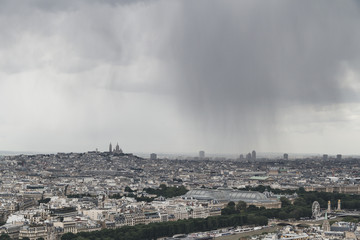 Fototapeta premium View of the city of Paris, France from top of Eiffel Tower on a cloudy day