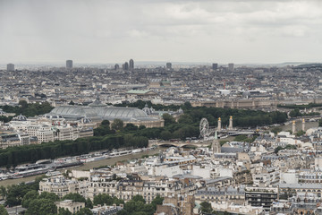 Fototapeta na wymiar View of the city of Paris, France from top of Eiffel Tower on a cloudy day