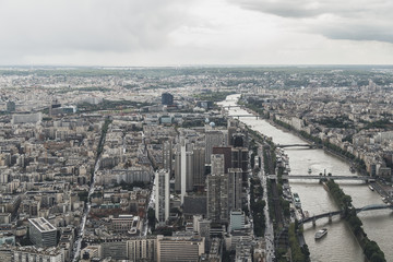 View of the city of Paris, France from top of Eiffel Tower on a cloudy day
