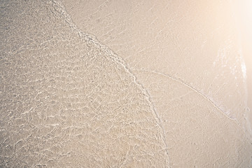 Beach and soft wave at the sea in summer holiday concept.