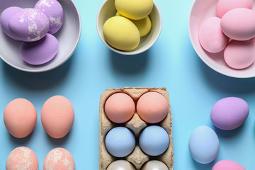 Different Easter eggs on color background