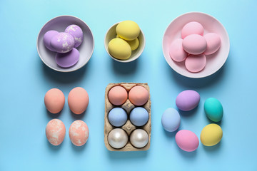 Different Easter eggs on color background