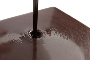 Pouring melted chocolate, closeup