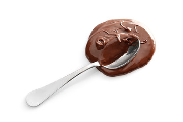 Spoon with melted chocolate on white background