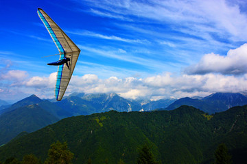 Hang glider pilot in Italian mountains