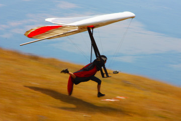 Hang glider pilot in Italian mountains