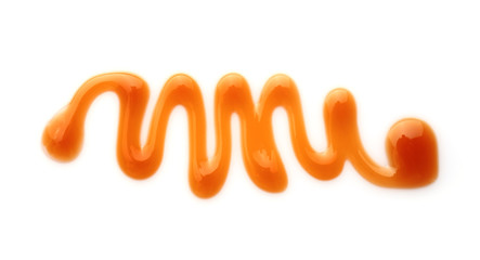 Liquid caramel on white background
