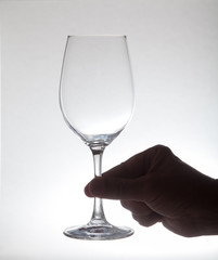 Glass wine glass in hand