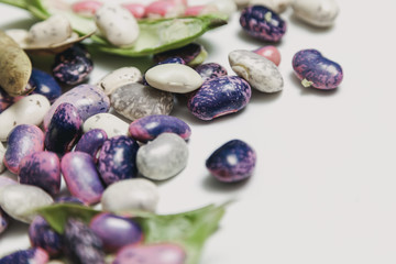 Multicolored beans on white background