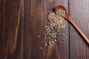 Hemp seeds on wooden spoon