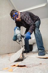 man in glasses works as perforator in pantry