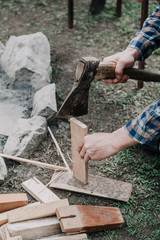Hands with split wooden board