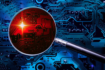 Blue circuit board background of computer motherboard and magnifier glass with red zoomed virus zone. Investigation for cybersecurity.