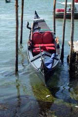 Obraz premium Gondola awaiting tourists for a ride at Grand canal in Venice, Italy 