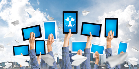 Close of man hands in line showing tablet pc with blank blue screen