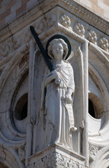 Obraz premium Archangel Michael with sword, detail of the Doge Palace, St. Mark Square, Venice, Italy, UNESCO World Heritage Sites 