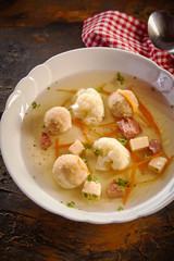 Bowl of spring broth with bone marrow dumplings