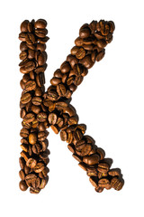 Roasted coffee bean letter K isolated on white