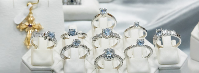 Jewelry diamond rings show in luxury retail store window display showcase