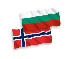 National vector fabric wave flags of Norway and Bulgaria isolated on white background. 1 to 2 proportion.