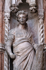 Fototapeta premium Statue on the Porta della Carta, detail of the Doge Palace, St. Mark Square, Venice, Italy, UNESCO World Heritage Sites 