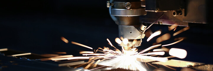 Sparks fly out machine head for metal processing