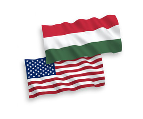 National vector fabric wave flags of Hungary and America isolated on white background. 1 to 2 proportion.