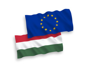 National vector fabric wave flags of Hungary and European Union isolated on white background. 1 to 2 proportion.