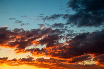 Dramatic orange sky clouds at sunset