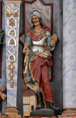 Obraz premium Statue of Saint Florian on the main altar in the Church of Assumption of the Virgin Mary in Pokupsko, Croatia